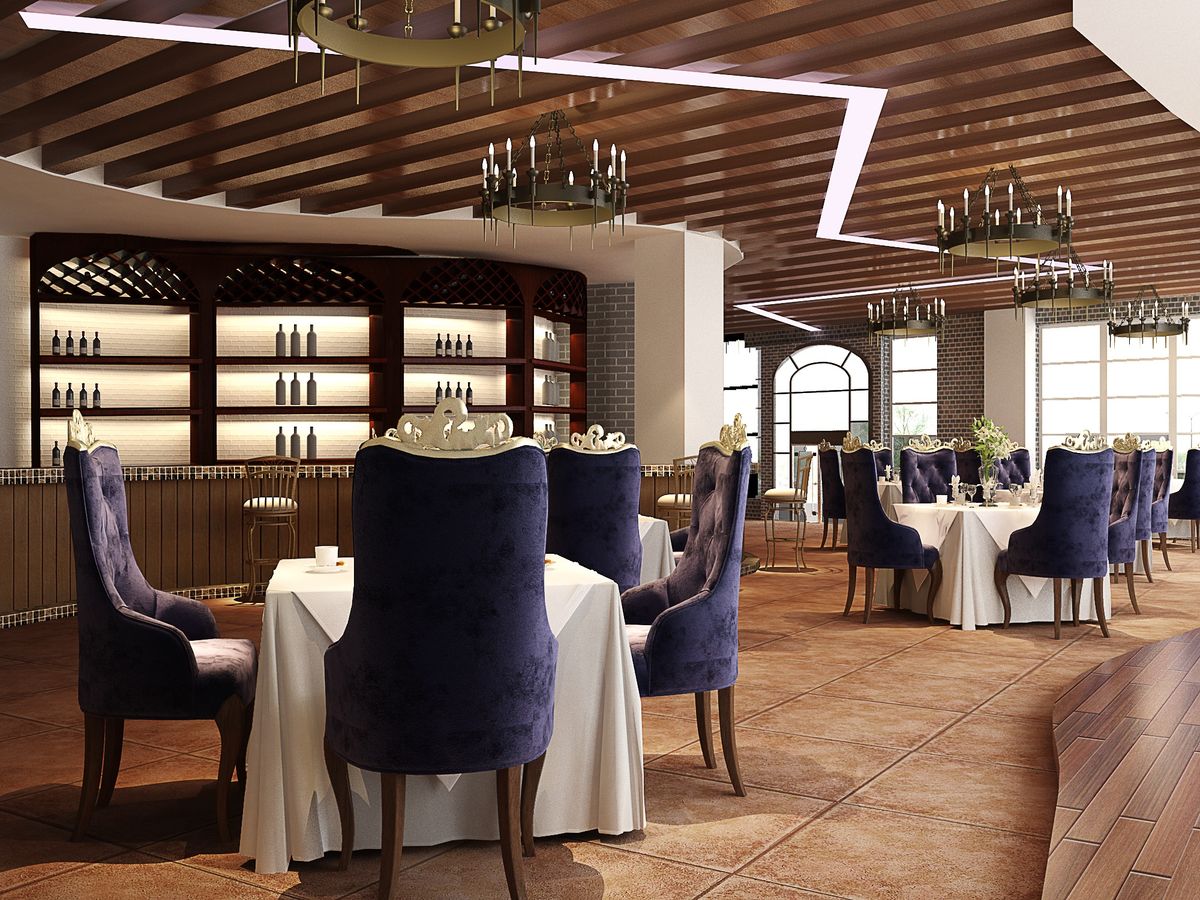 Elegant hotel dining room beneath statement lighting
