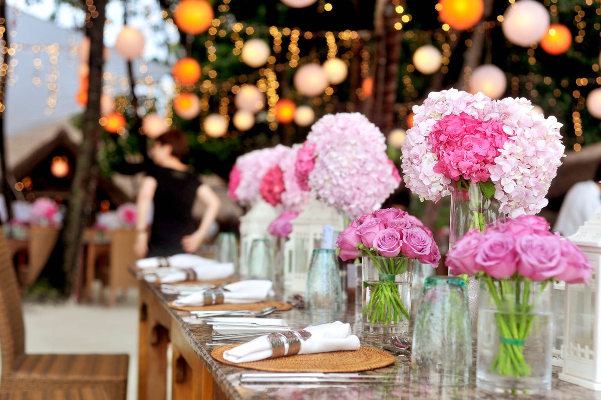 Event table dressed with flowers and candlelight