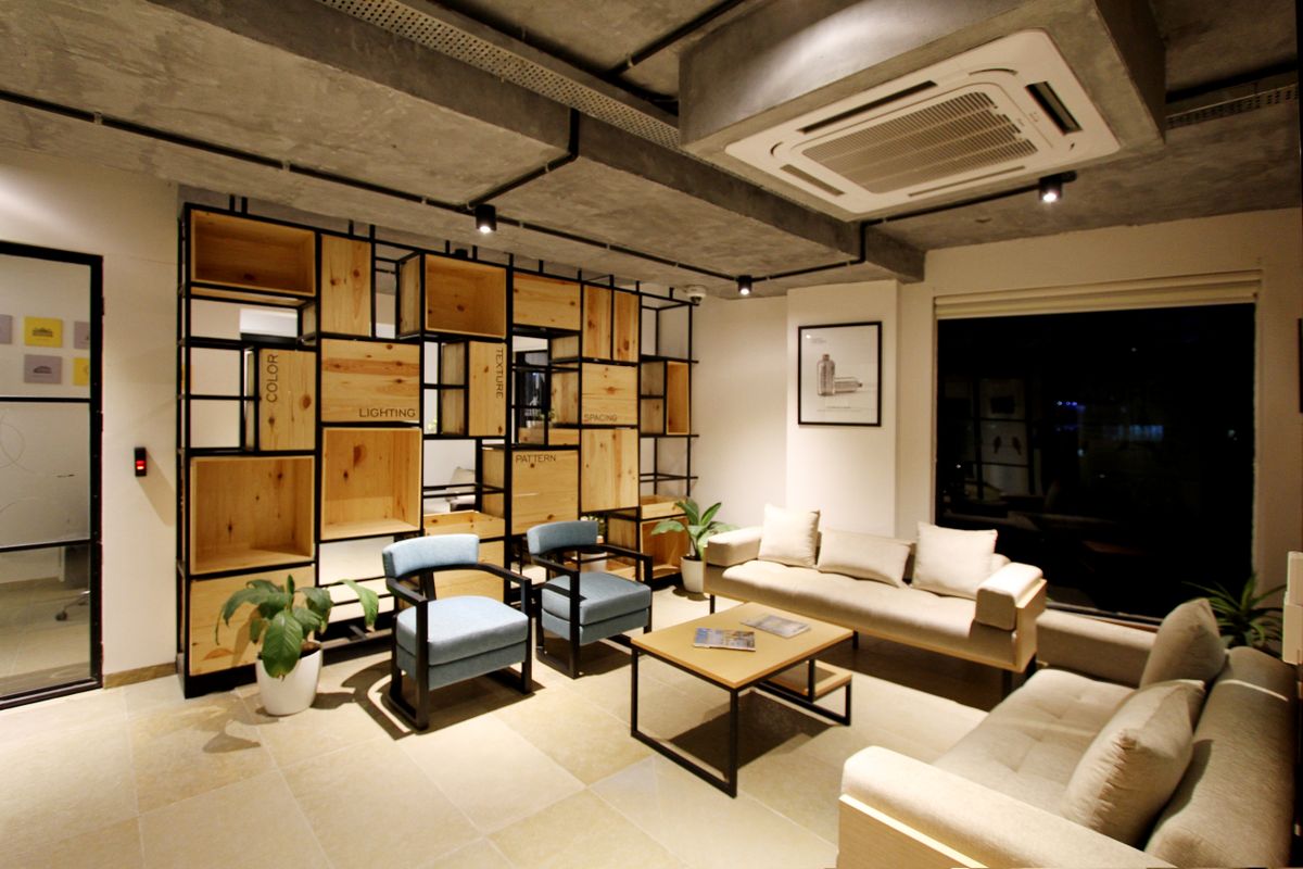 Hotel lounge with warm timber, soft seating and greenery