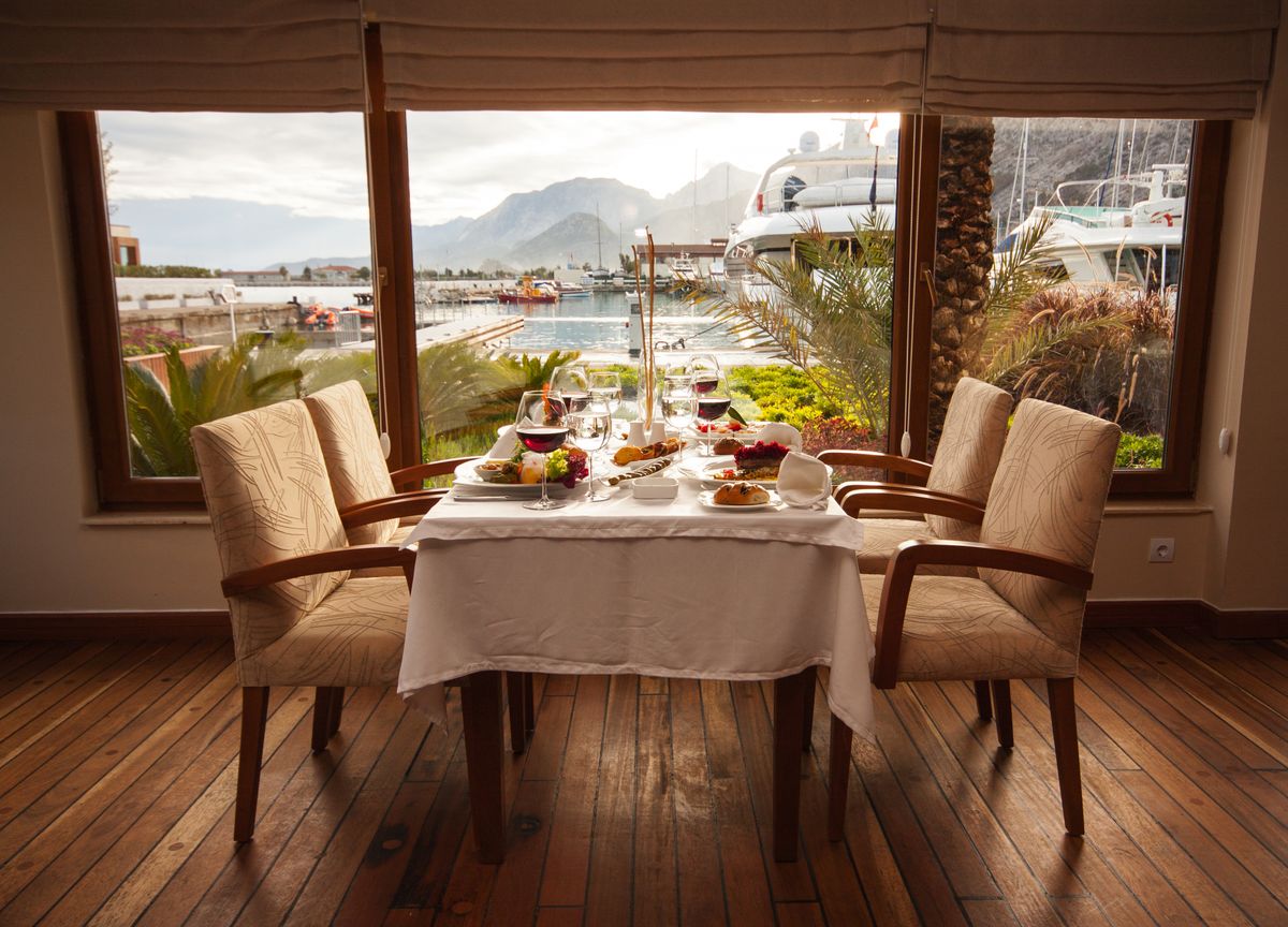 Open pre-function room with windows overlooking the view