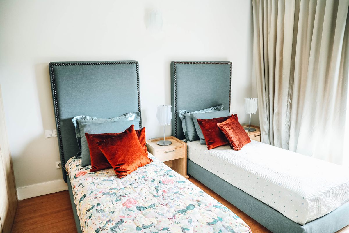 Family suite with a king bed and a long sofa